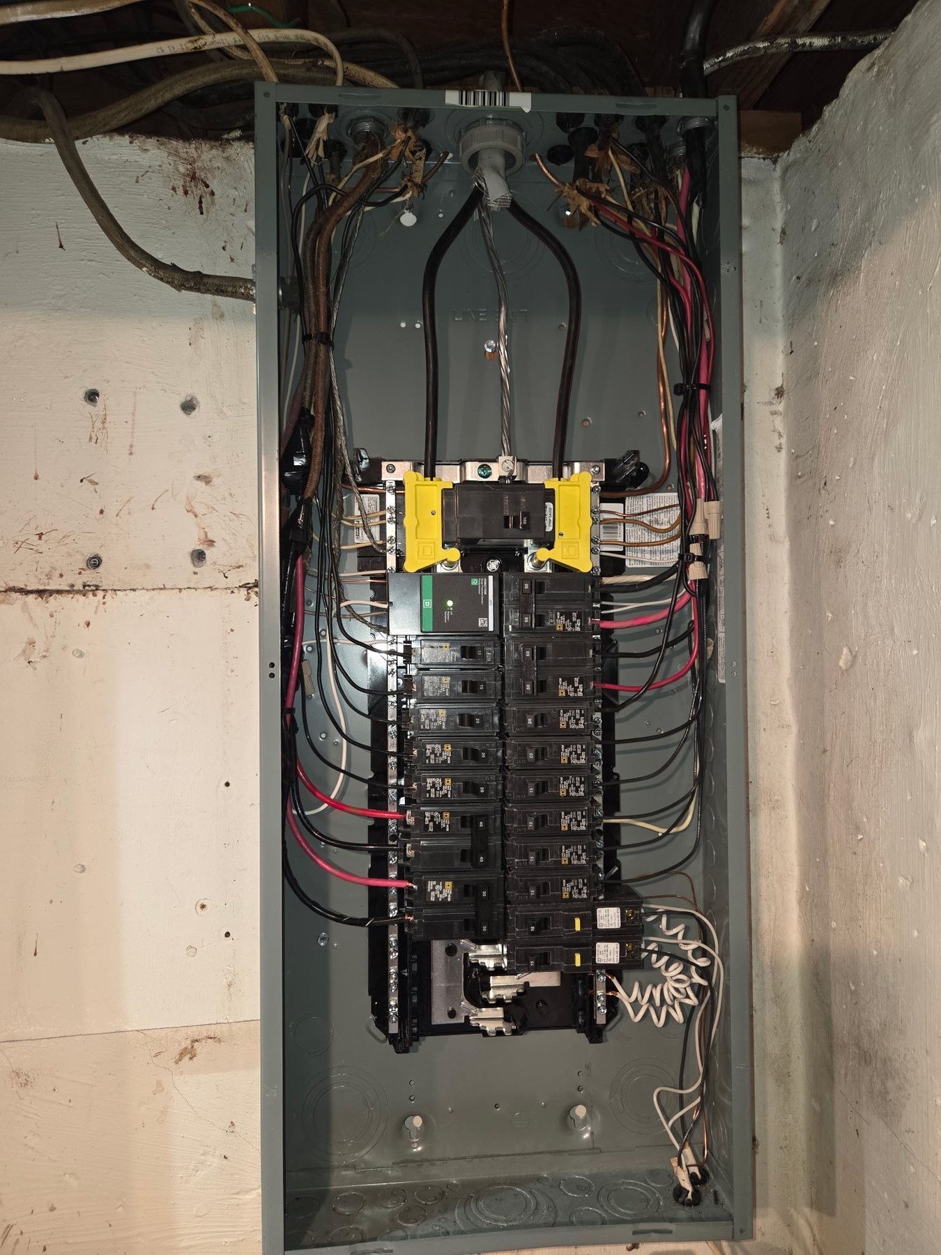 Open electrical panel showing breakers and wiring